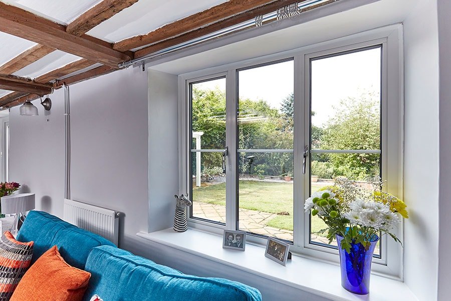 White aluminium casement window open close up